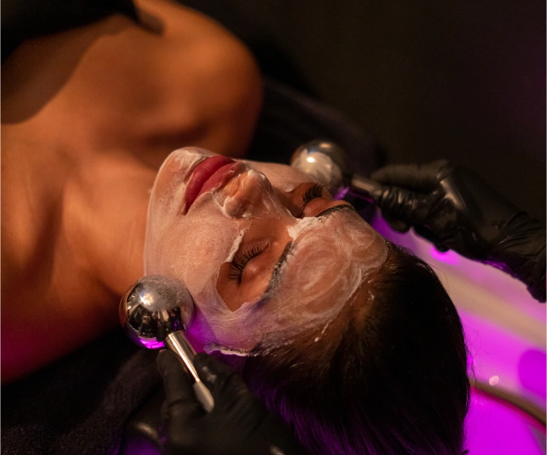 1-2home Deeply relaxed woman undergoing a scalp treatment